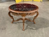 Antique Victorian carved oval accent table with beautiful black marble top.