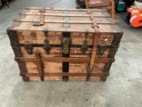 Nice Vintage Trunk with wrap-around leather straps. Stamped 'Buckeye'.