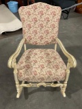 Vintage whitewashed wooden floral upholstered rocking chair.