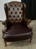 VINTAGE LEATHER ARM CHAIR WITH WING BACK FROM LOCAL BISTRO.