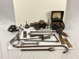A lot of different antique tools, vice and cobbler set in case.