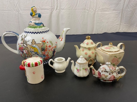 Alice in Wonderland Teapot, 5 miniature teapots, and a mini cookie jar