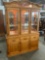 China cabinet with display notches and lighting.