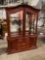 Lighted Cherry Hutch with intricate carving details throughout. Beautiful piece.