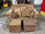 Comfy couch with cushions and extra pillows also has square cushion ottoman's.