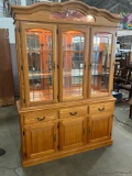 China cabinet with display notches and lighting.