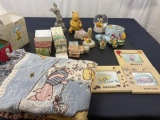 Large Lot of Winnie the Pooh Items, Blanket, Rubber Stamps, Decor Items, and snow globes.