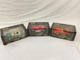 collection of 3x Burago 1/18 scale die cast cars in their original boxes.