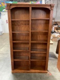 Beautiful book case with glass center shelves and display lights on top.
