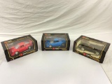 lot of 3x Burago 1:18 scale die cast cars in their original boxes. like new condition.