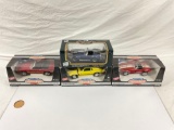 lot of American Muscle and Road Tough 1:18 scale die cast cars in original boxes.