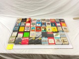 Large lot of vintage 8 track tapes (many still factory sealed), head cleaner & cassette adapter.
