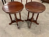 Lot of two vintage round end tables with pedestal base and intricate designs on the wood.