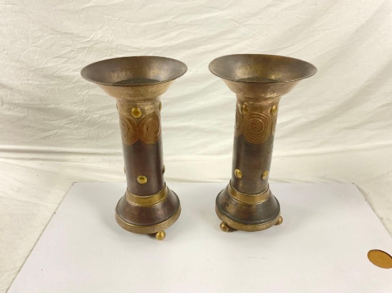 2x floor metal candle holders with ornate designs,