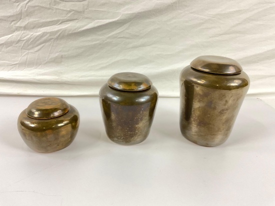 3 piece set of prison made canister pottery with lids.