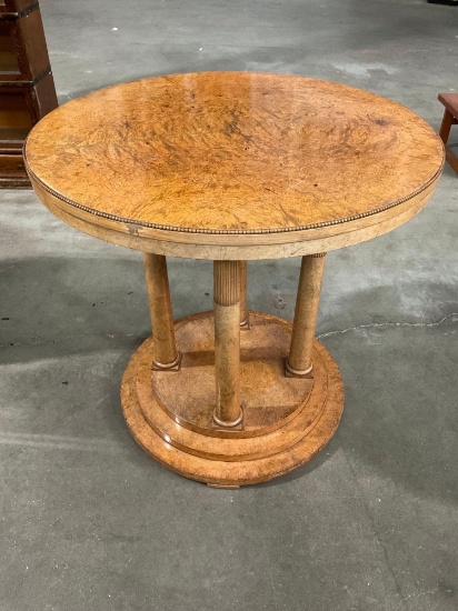 Vintage wooden round table with columns.