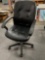 Black office chair with adjustable lever.