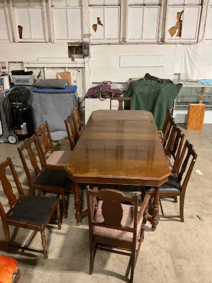 Large antique dining table and chairs from GREGORY Furniture. Table, 4 leaves, and 11 chairs.