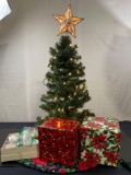 3ft Tall Lighted Christmas Tree with topper, tree skirt, and fake presents.