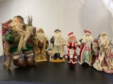 7 Assorted Santa Claus Figures, one in a large chair