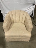 Beige half-barrel chair with floral upholstery pattern by BEST CHAIRS, INC.