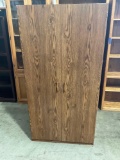 Wood laminate closet cabinet.