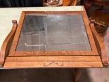 Wooden frame mirror for a desk or vanity.
