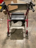 Drive walker with wheels and brakes on both handles.