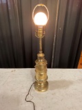 Brass desk lamp with no shade.