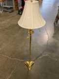 Floor lamp with shade.