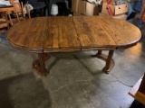 Beautiful oak dining table with leaves.