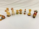 lot of various collectible porcelain statues.