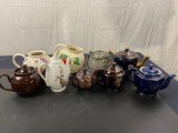 Lot of 8 Pottery Teapots of various makes, and one pitcher with a strawberry motif