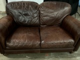 LEATHER UPHOLSTERY LOVE SEAT FROM LOCAL OLYMPIA BISTRO.