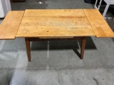 Beautiful wooden coffee table with extensions.