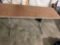 Custom heightened wood laminate table.