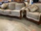 Set of ASHLEY Furnitures matching couch and chair with throw pillows.