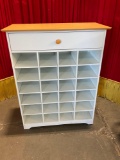Wood shoe cabinet with top drawer.