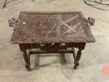 Vintage wood table with carved top and sides, glass cover piece with carved handles