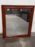 Wall mounted mirror with wooden frame