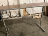 Custom heightened wood laminate table.
