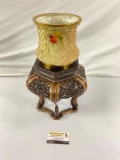 Vintage gold rimmed ornate Victorian-style vase on wooden stand,