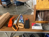 Lot of miscellaneous saws and saw blades for power tools.