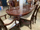 Queen Anne style dining table with six chairs and leaf.