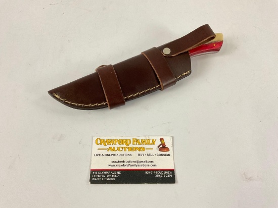 Handmade Damascus steel upsweep knife with custom red white and blue wood/bone handle and leather