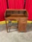 Small vintage wooden roll-top desk