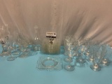 24 pc.lot of vintage etched Fostoria glass tableware; drinking glasses, plates, candleholders