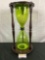 Tall mahogany case green glass oversized hourglass decor piece - approx 23 x11
