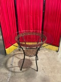 Circular Glass Table on metal base with woven accents