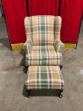 Vintage wooden upholstered armchair and ottoman